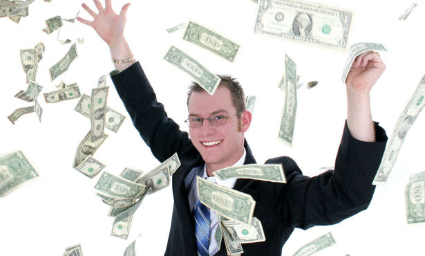 Attractive Business Man In Suit Throwing Money Into Air